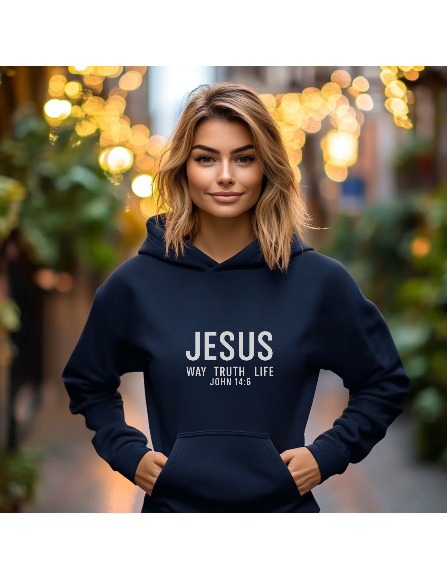 Woman wearing black hoodie with the words Jesus Way Truth Life John 14:16. Christian Faith Unisex Hoodie
