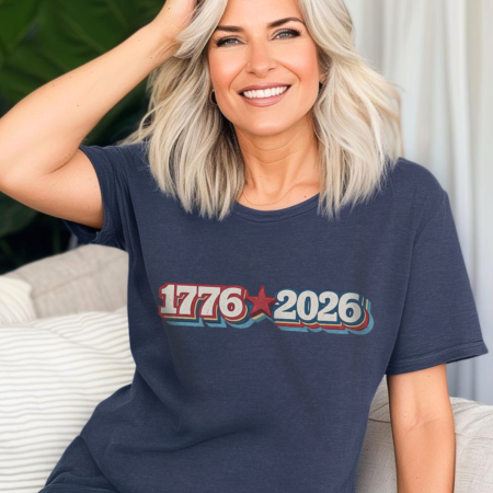 Woman wearing royal blue Vintage USA Graphic 1776-2026 Tee